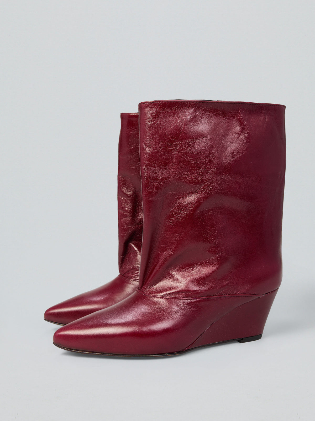 Tronchetti in pelle con zeppa
