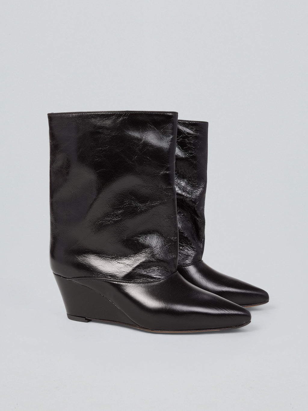 Tronchetti in pelle con zeppa