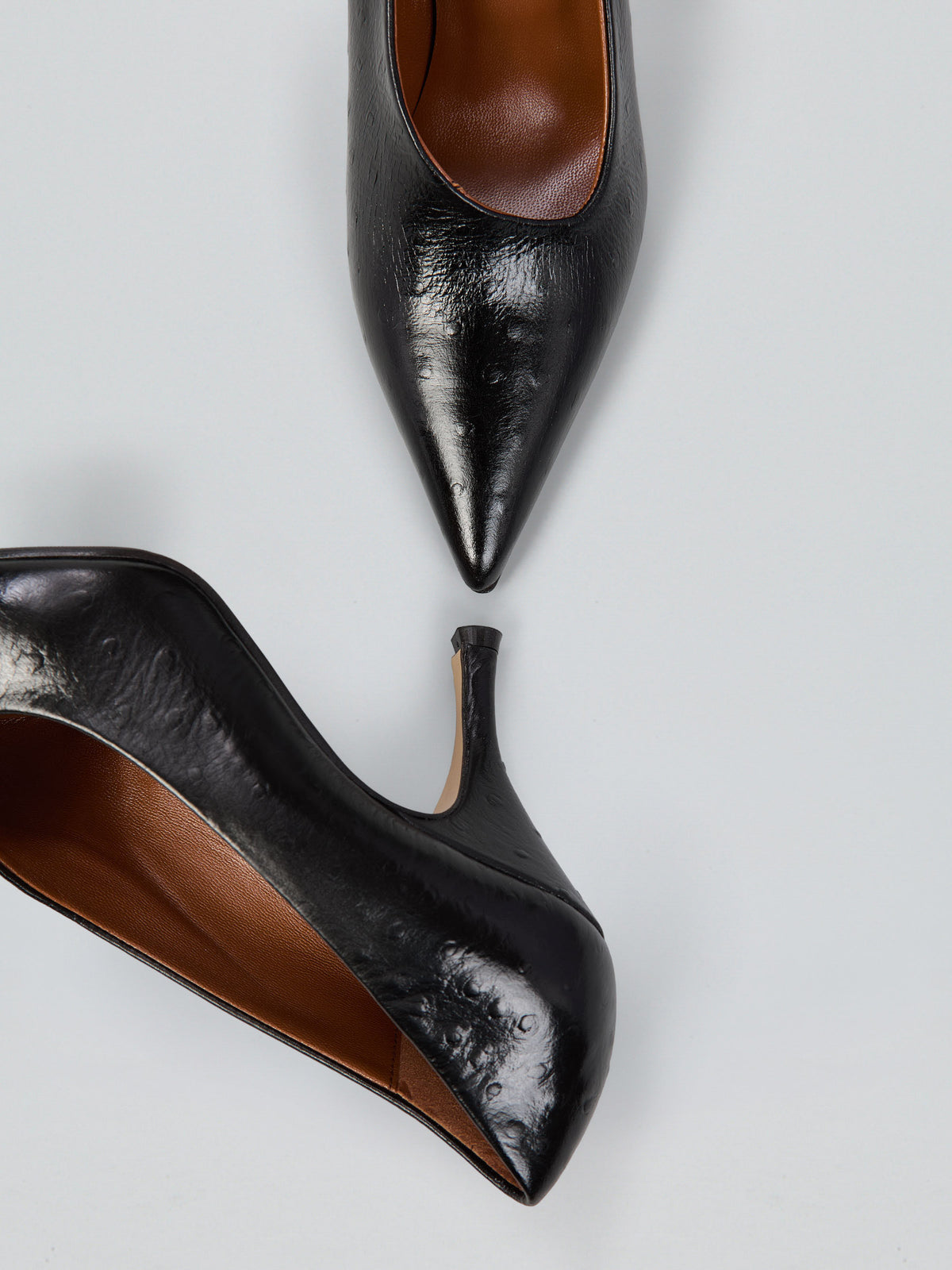 Décolleté in pelle con scollo asimmetrico
