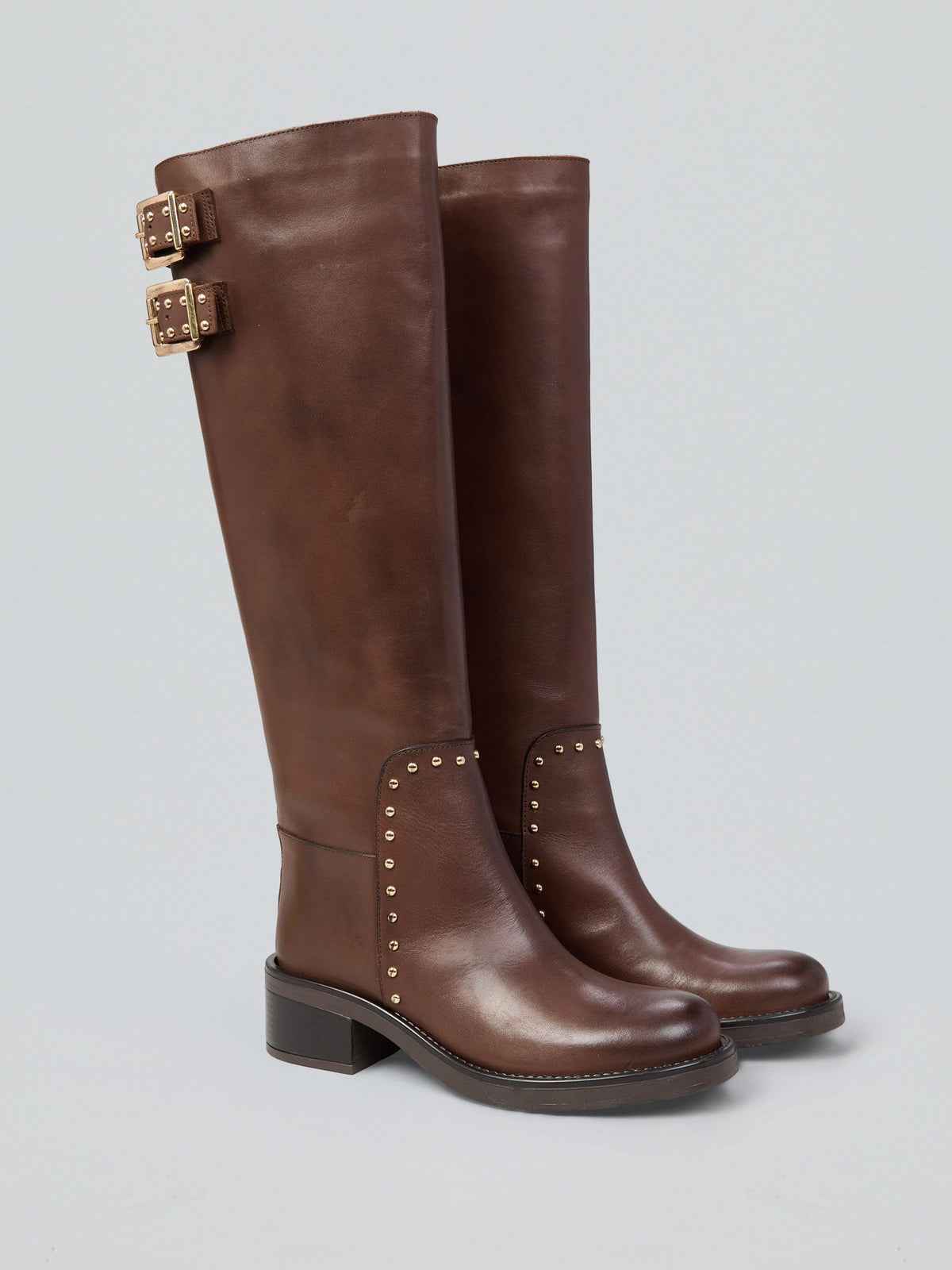 Leather boots with studs and buckles