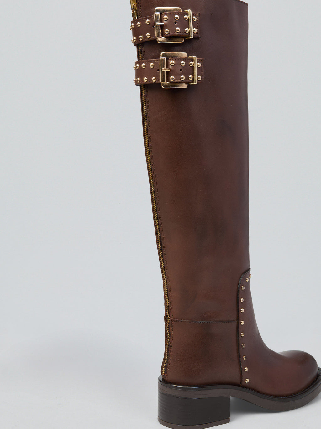 Leather boots with studs and buckles