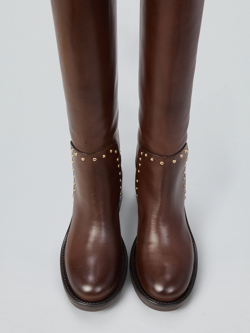 Leather boots with studs and buckles