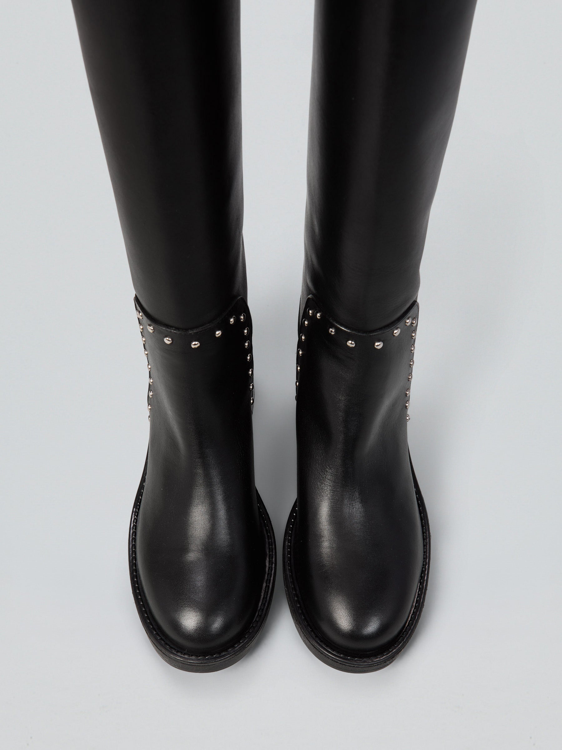 Leather boots with studs and buckles